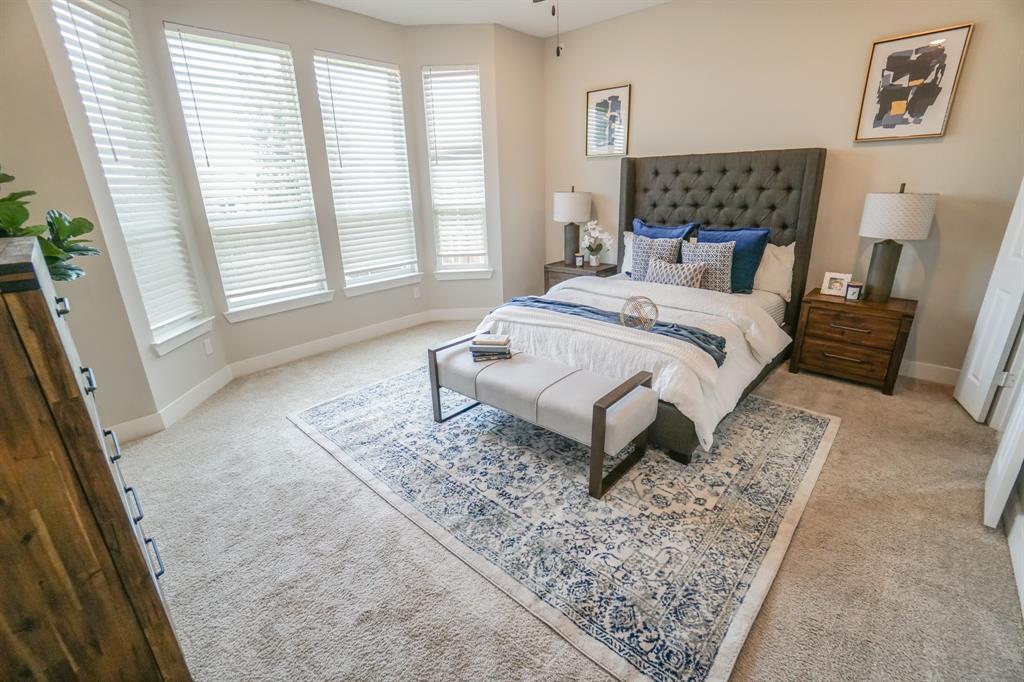 1309 Old Rocksprings Pass Mansfield, TX 76063 - Photo 12 of 36 Carpeted bedroom featuring a bay window with blinds, a ceiling fan, and painted walls