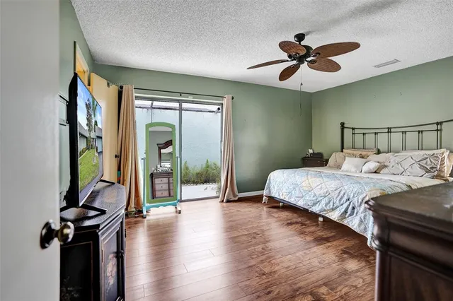 a view of walk in closet with clothes