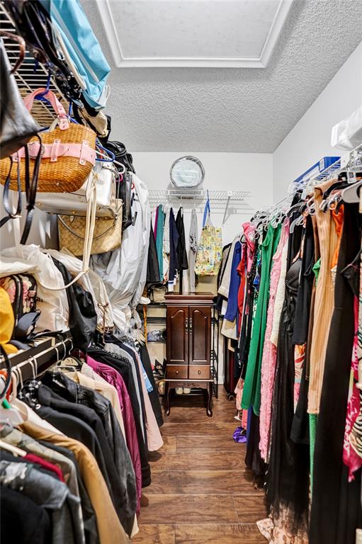 9132 Southwest 20th Street, Unit B Boca Raton, FL 33428 - Photo 29 of 81 a view of walk in closet with clothes and shoes