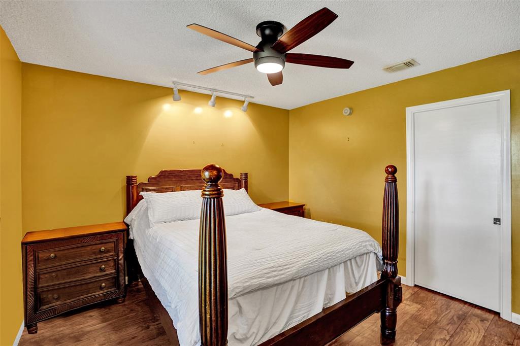 9132 Southwest 20th Street, Unit B Boca Raton, FL 33428 - Photo 37 of 81 a bedroom with a bed and a ceiling fan