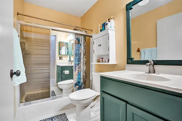 a view of house with backyard