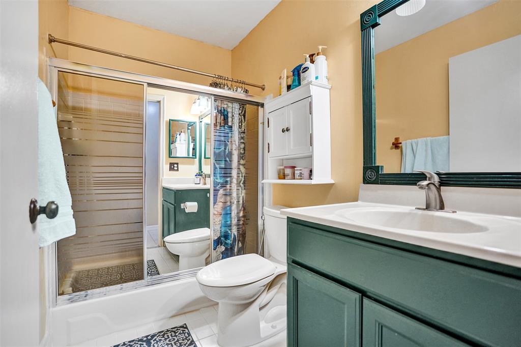 9132 Southwest 20th Street, Unit B Boca Raton, FL 33428 - Photo 38 of 81 a bathroom with a granite countertop sink toilet and shower