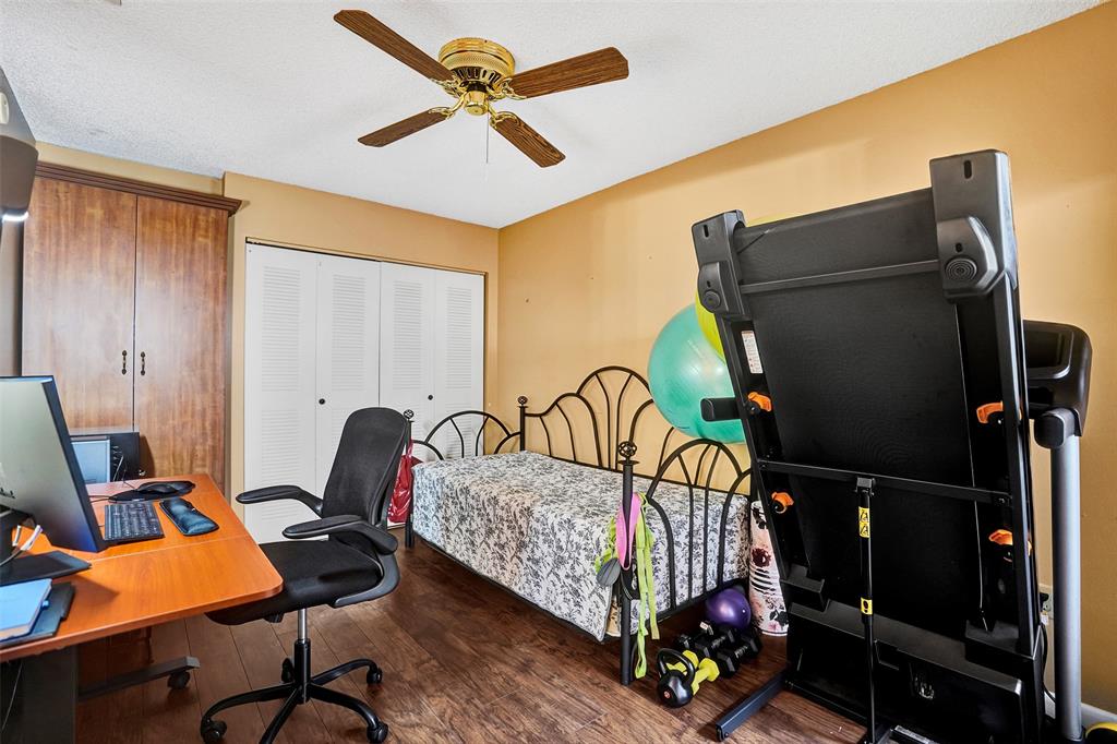 9132 Southwest 20th Street, Unit B Boca Raton, FL 33428 - Photo 43 of 81 a bedroom with a bed and a desk