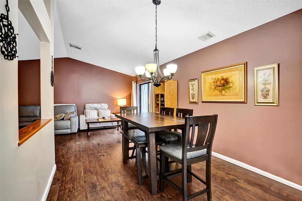 9132 Southwest 20th Street, Unit B Boca Raton, FL 33428 - Photo 9 of 81 a view of a dining room with furniture and wooden floor