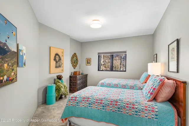 a bedroom with a bed and dresser