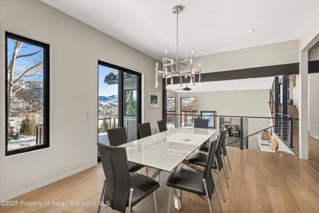 a view of a dining room with furniture window and wooden floor