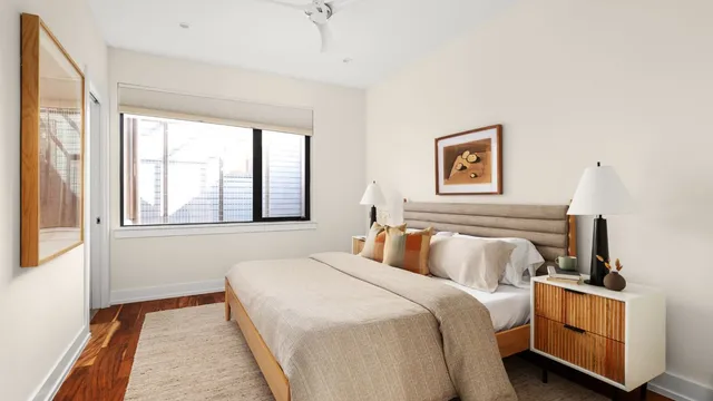 a bedroom with bed and window