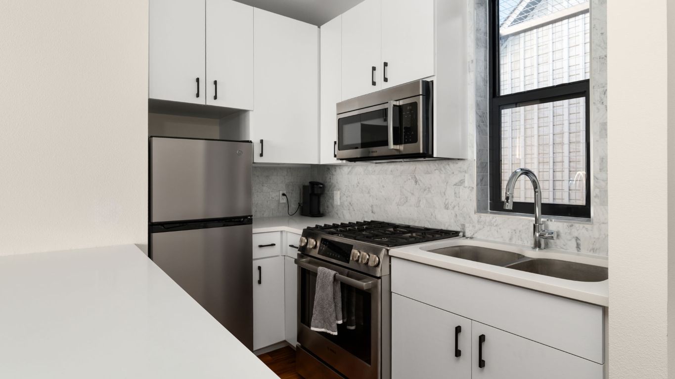 3813 Tilley Street Austin, TX 78723 - Photo 20 of 26 a kitchen with a sink and steel appliances