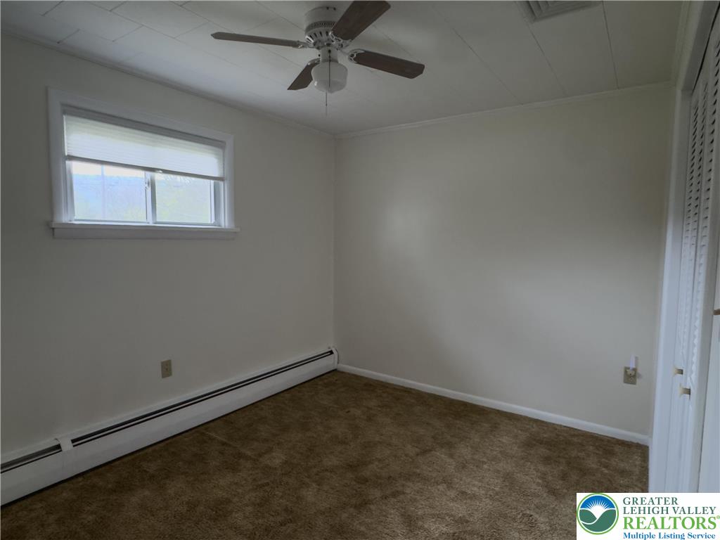 13 Craig Road Lehighton, PA 18235 - Photo 29 of 39 This cozy bedroom offers a warm ambiance with a practical layout for comfortable living.
