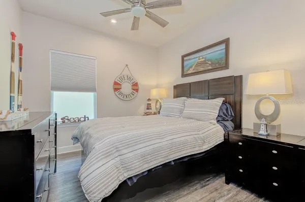 a bathroom with a double vanity sink toilet mirror and shower