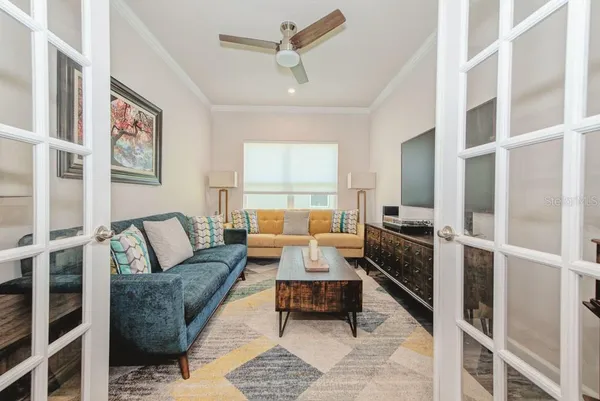 a view of a hallway with wooden floor and front door