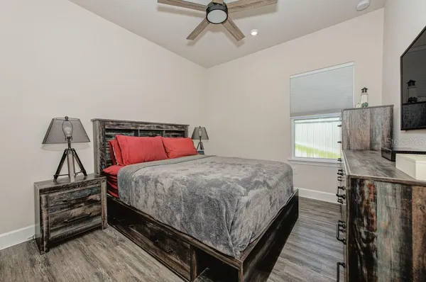 a view of a dining room with furniture wooden floor and chandelier