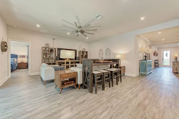 a living room with furniture and a large window