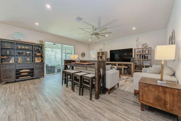 a living room with furniture and a large window