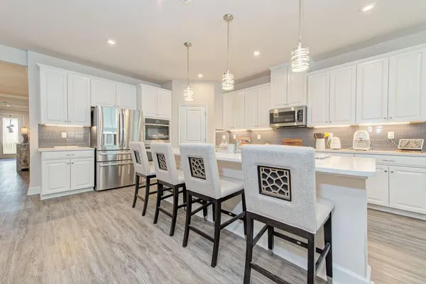 a bathroom with a sink vanity and a mirror