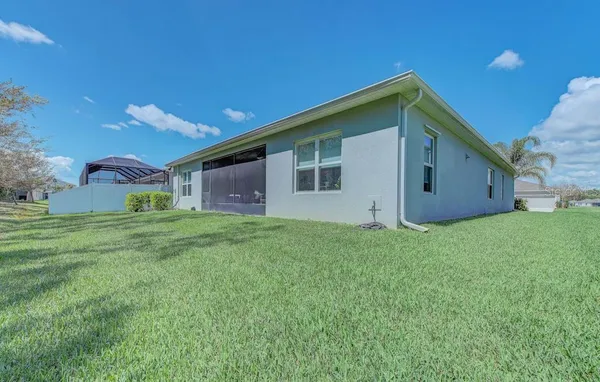 an aerial view of a house with a garden
