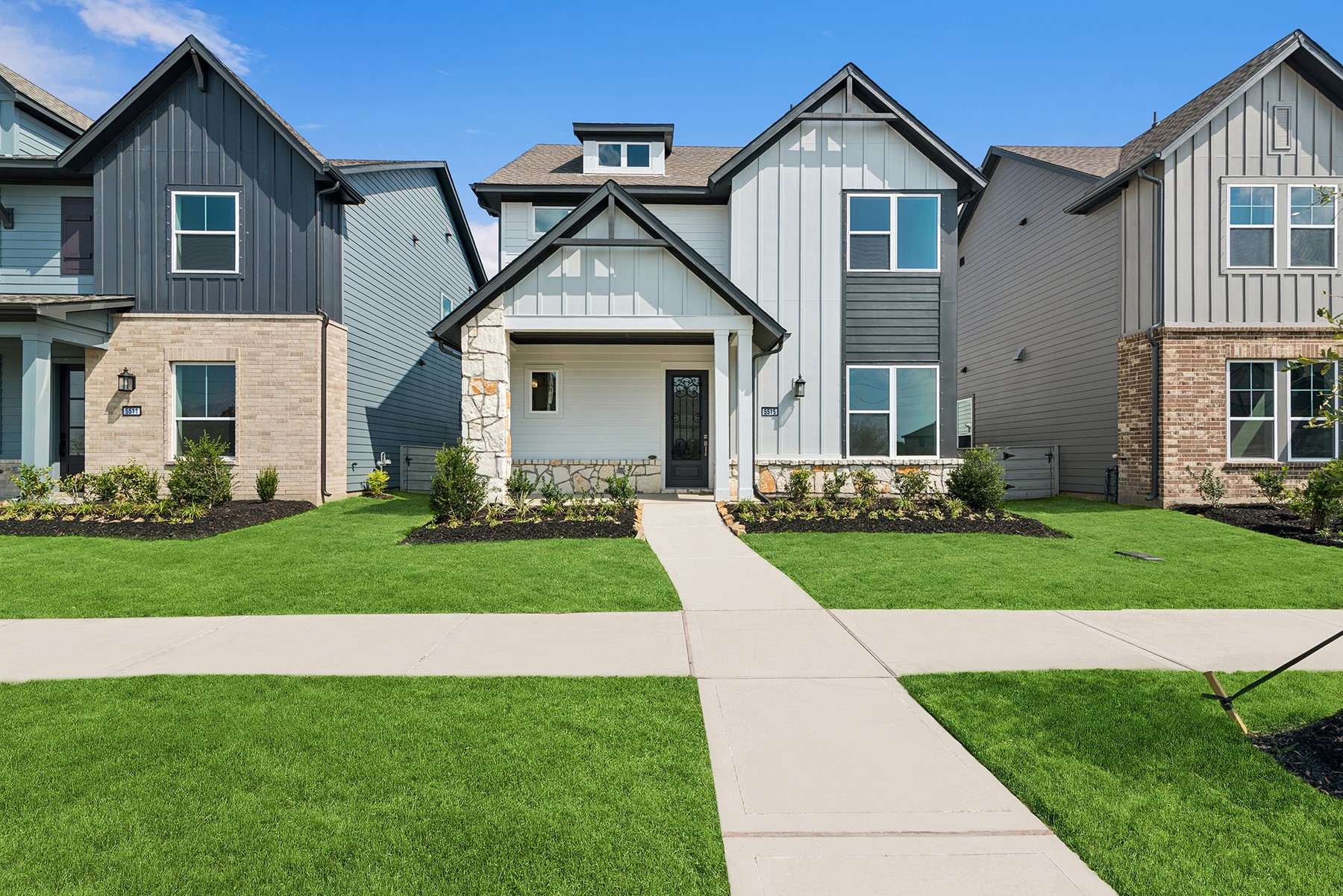 5515 Orangery Lane Manvel, TX 77578 - Photo 1 of 48 a front view of a house with a yard and garage