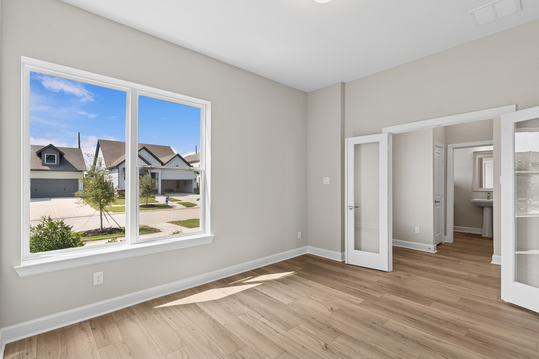 5515 Orangery Lane Manvel, TX 77578 - Photo 14 of 48 a view of a room with wooden floor and a window