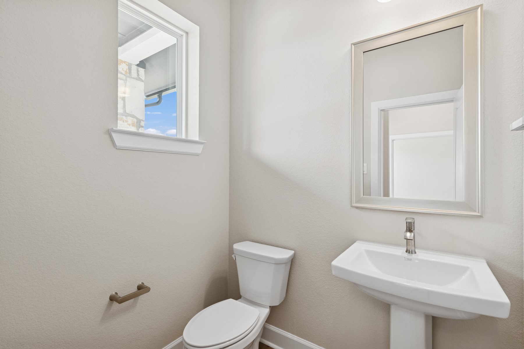 5515 Orangery Lane Manvel, TX 77578 - Photo 15 of 48 a bathroom with a toilet sink and mirror
