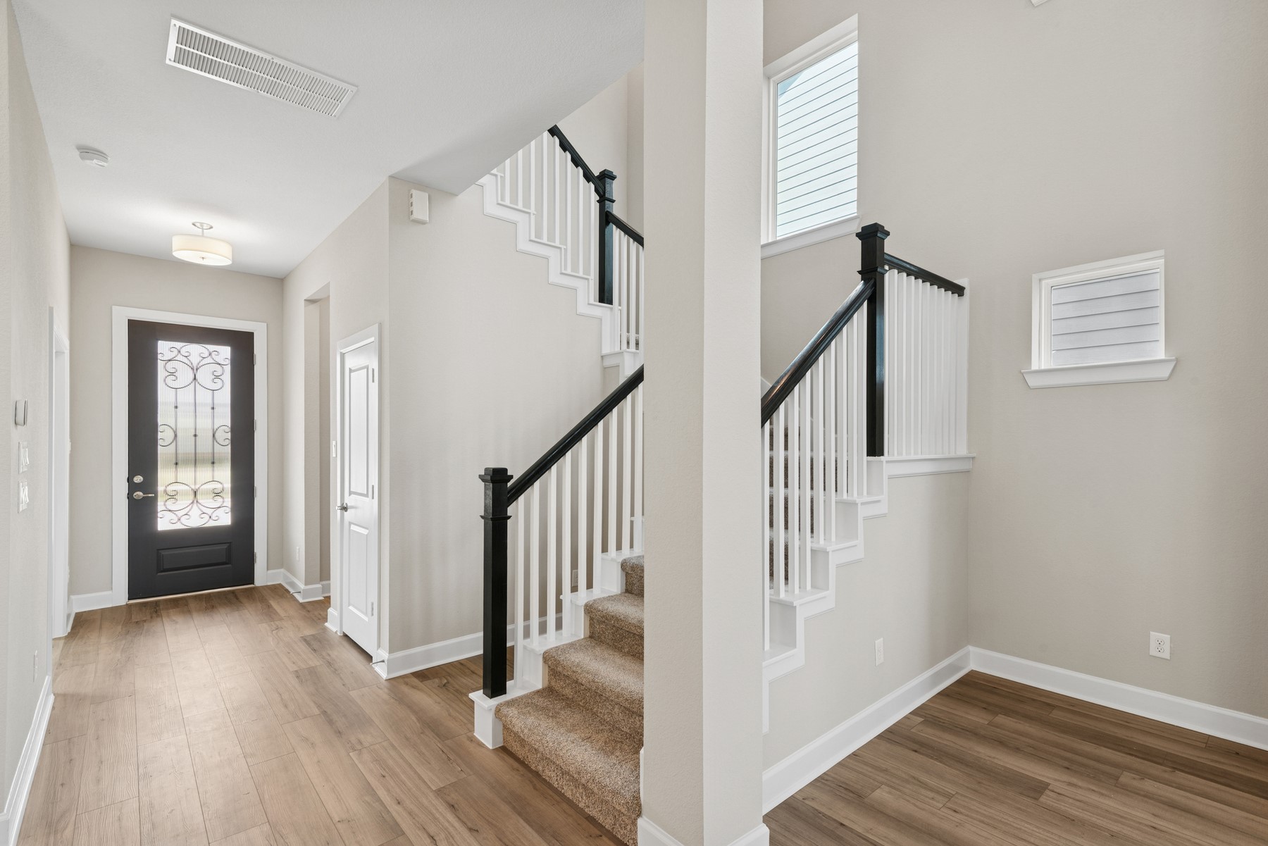 5515 Orangery Lane Manvel, TX 77578 - Photo 16 of 48 a view of hallway with stairs and wooden floor