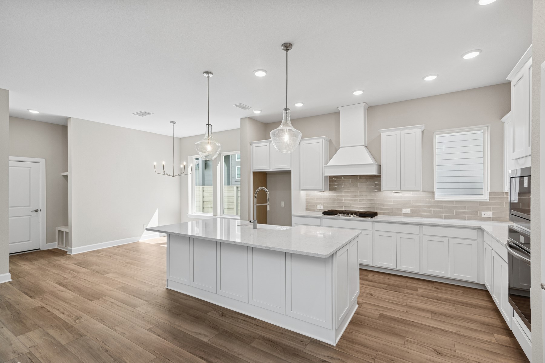 5515 Orangery Lane Manvel, TX 77578 - Photo 17 of 48 a large kitchen with stainless steel appliances granite countertop a stove a sink and a refrigerator