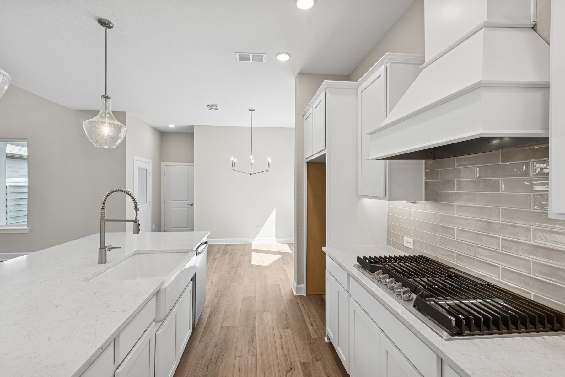 5515 Orangery Lane Manvel, TX 77578 - Photo 20 of 48 a kitchen with granite countertop a stove and a sink