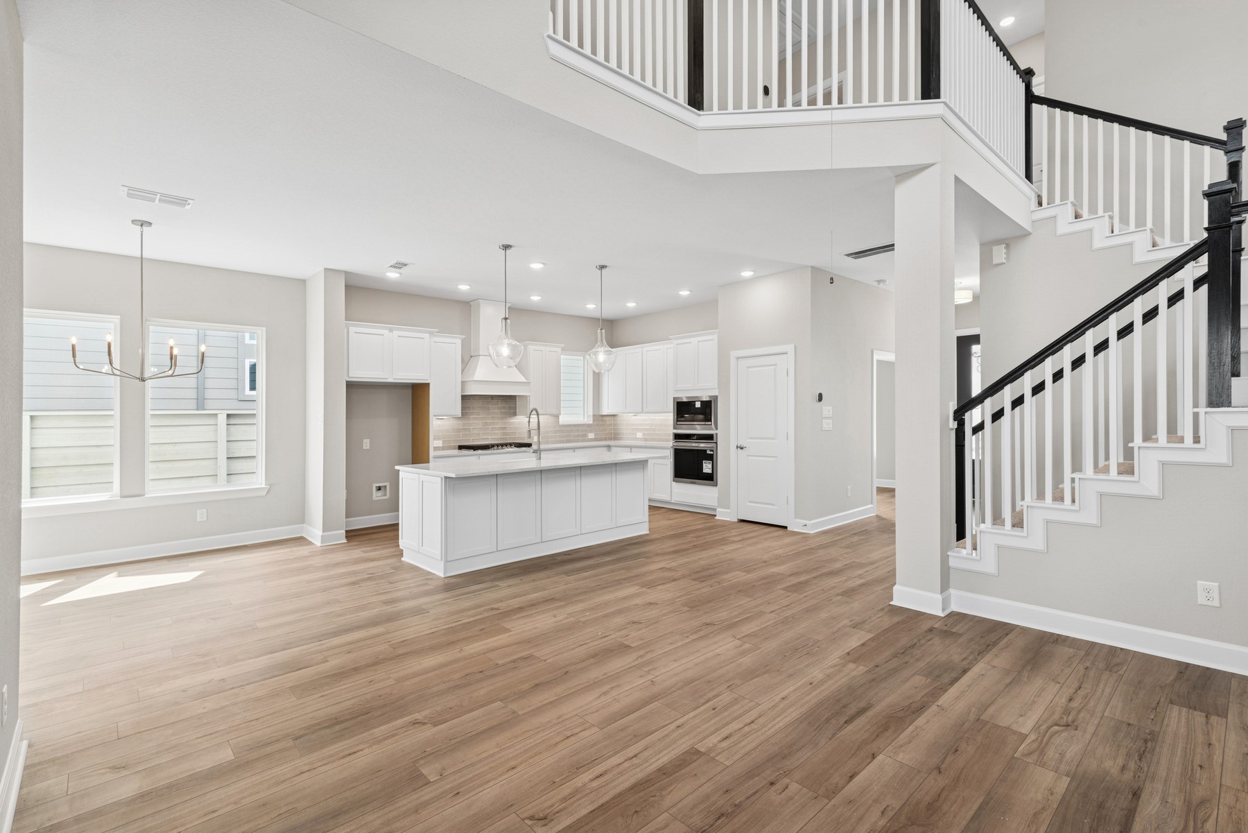 5515 Orangery Lane Manvel, TX 77578 - Photo 28 of 48 a view of kitchen with kitchen island wooden floor center island and stainless steel appliances