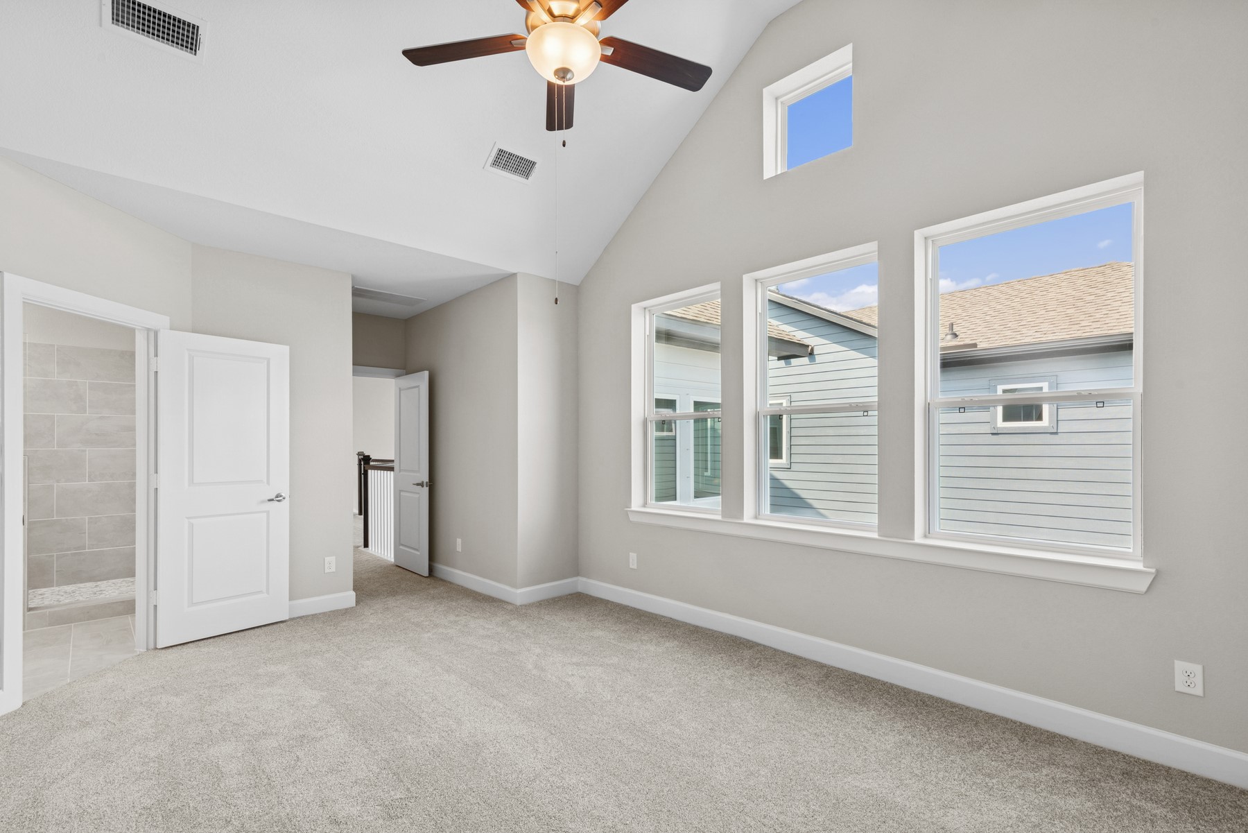 5515 Orangery Lane Manvel, TX 77578 - Photo 38 of 48 an empty room with chandelier fan and windows