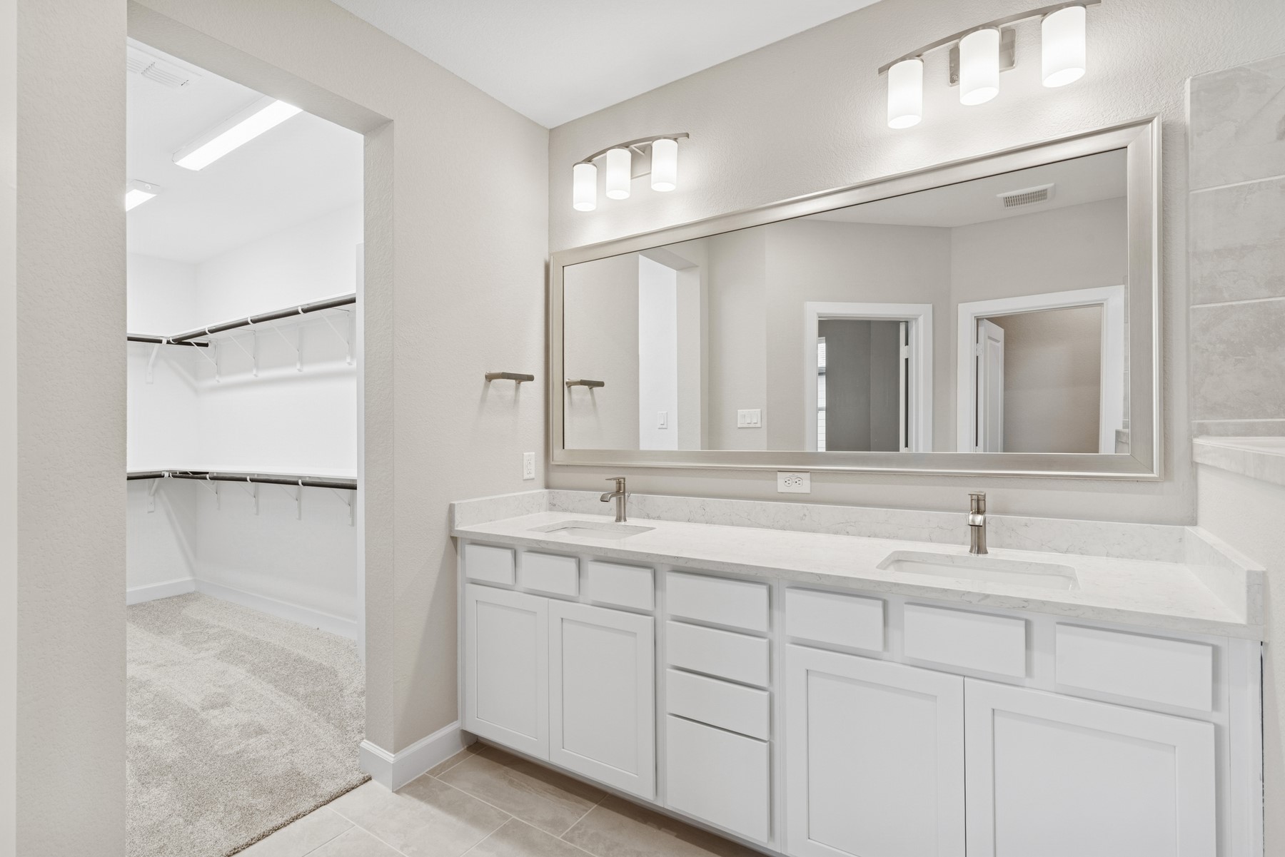 5515 Orangery Lane Manvel, TX 77578 - Photo 40 of 48 a bathroom with a double vanity sink and mirror