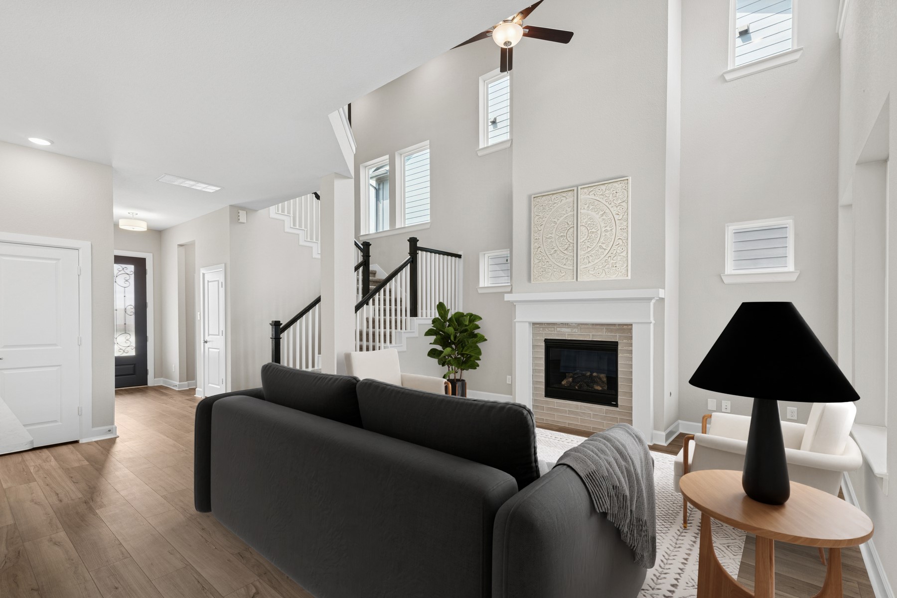 5515 Orangery Lane Manvel, TX 77578 - Photo 5 of 48 a living room with furniture or chandelier and a fireplace