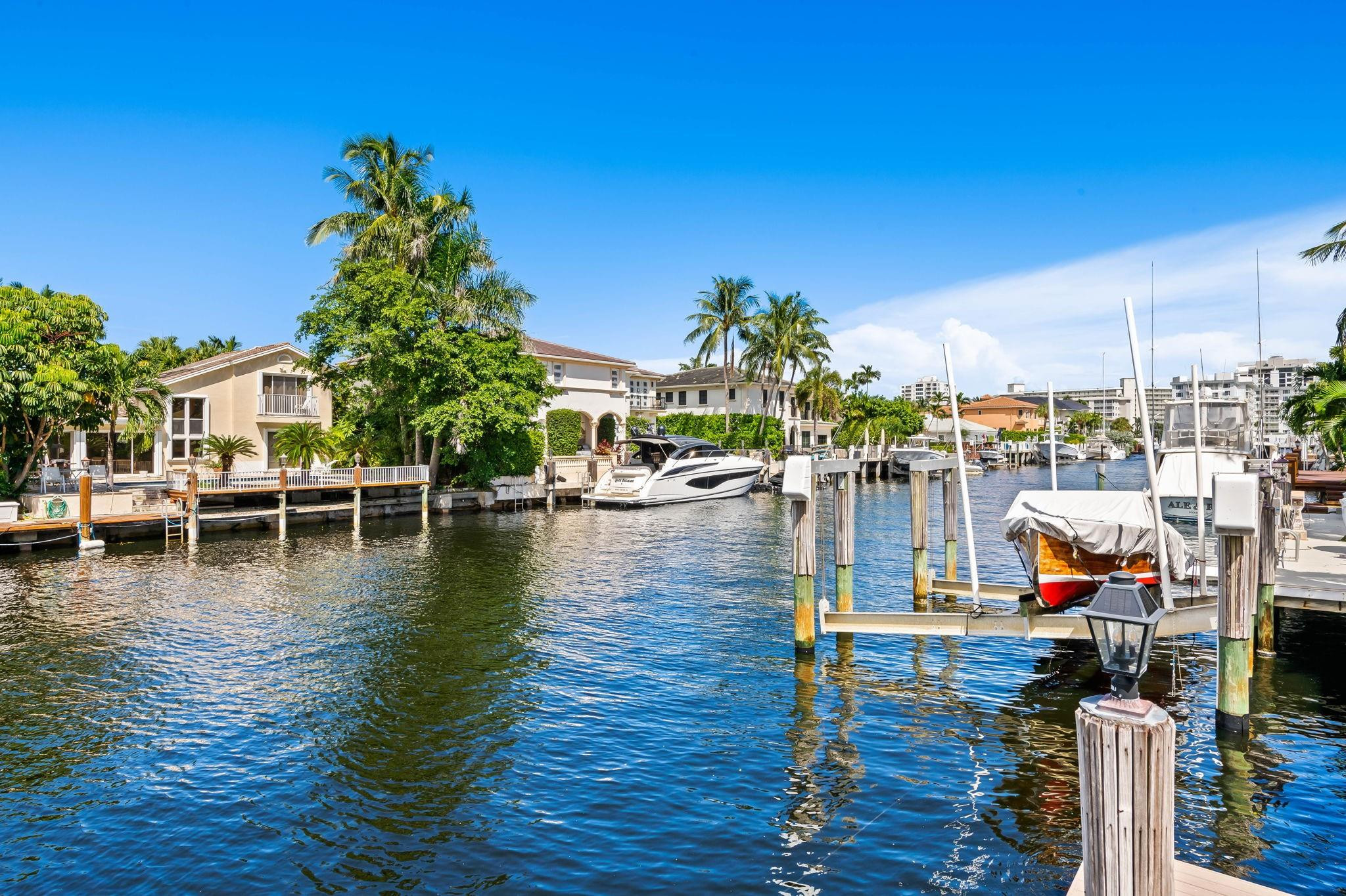861 Nafa Drive Boca Raton, FL 33487 - Photo 14 of 58 a view of a lake with lawn chairs