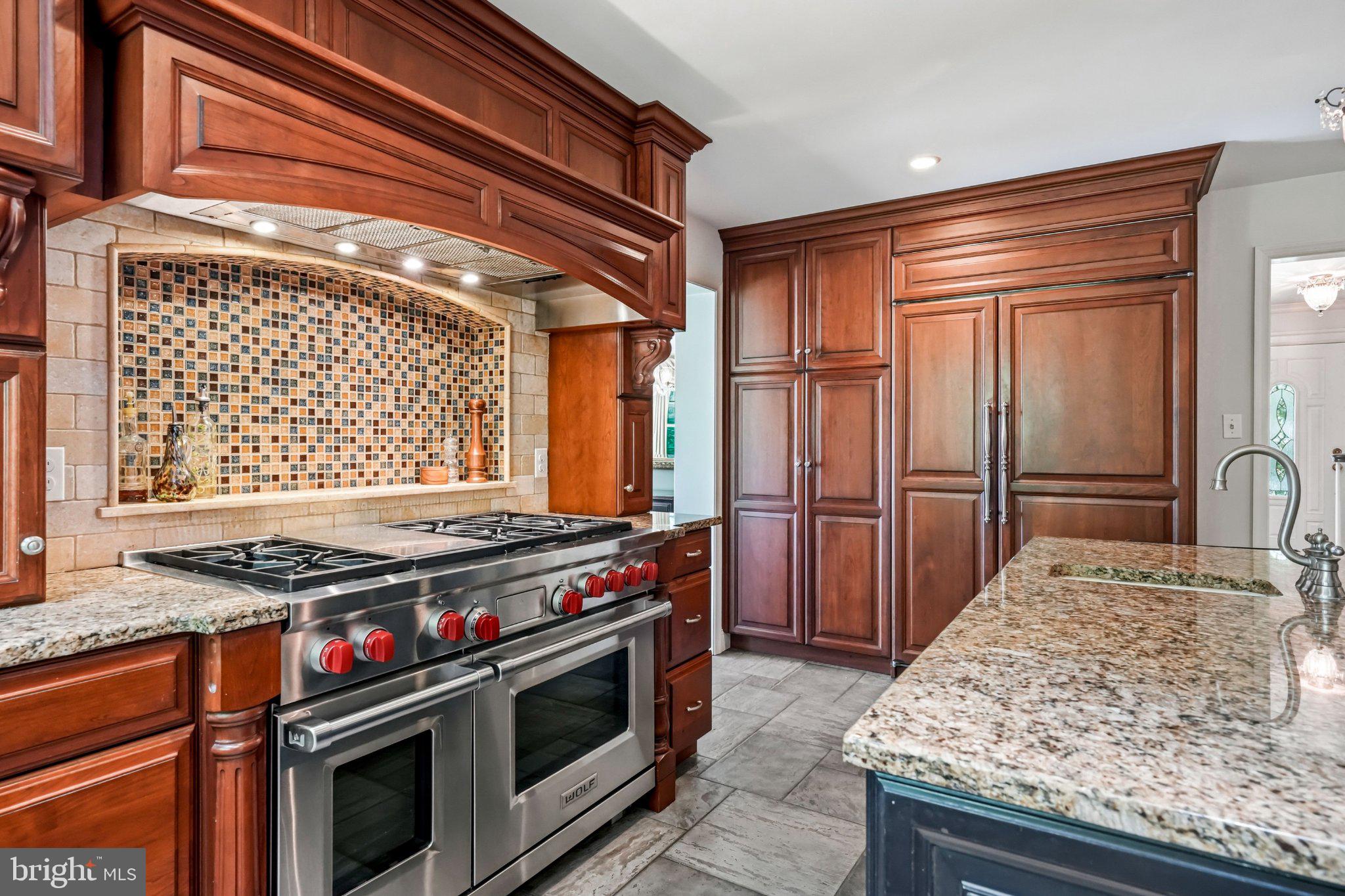 630 Leopard Road Berwyn, PA 19312 - Photo 18 of 91 Elegant kitchen with rich wood accents.