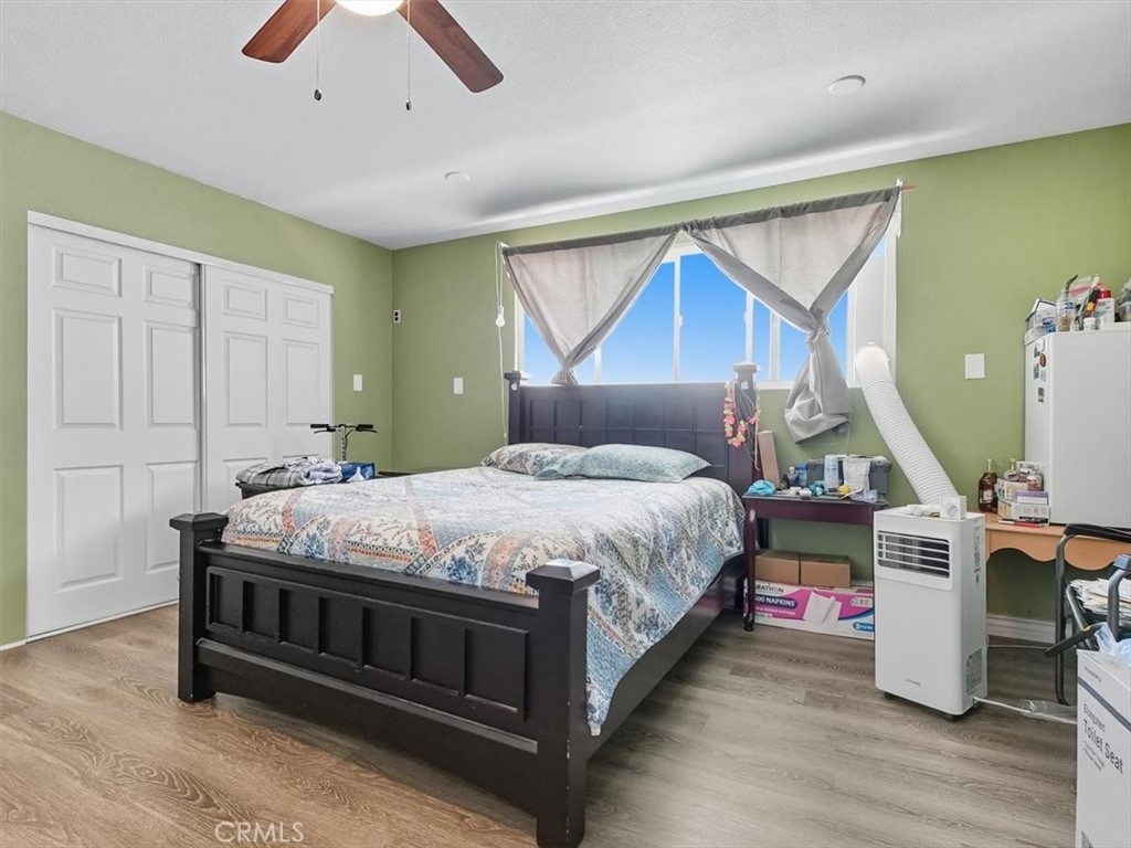 1407 Colonial Avenue Anaheim, CA 92802 - Photo 15 of 33 a bedroom with a bed and a chandelier