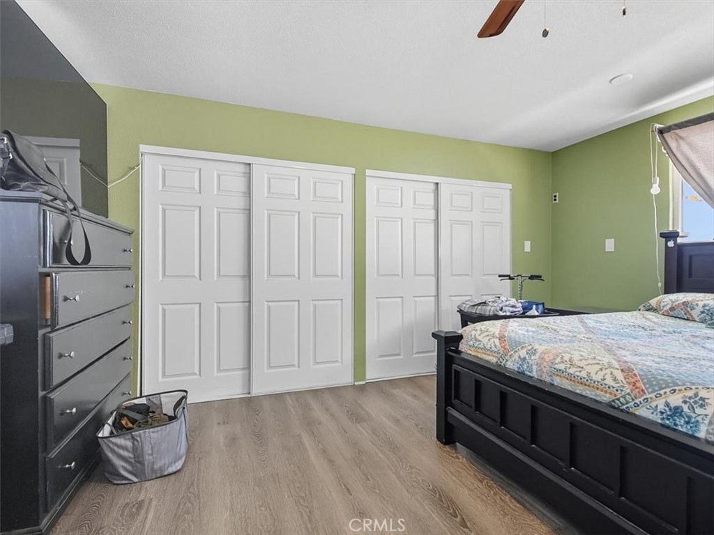 1407 Colonial Avenue Anaheim, CA 92802 - Photo 16 of 33 a bedroom with a bed and a dresser