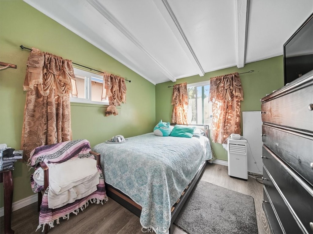 1407 Colonial Avenue Anaheim, CA 92802 - Photo 19 of 33 a bedroom with a bed and a tv on the dresser