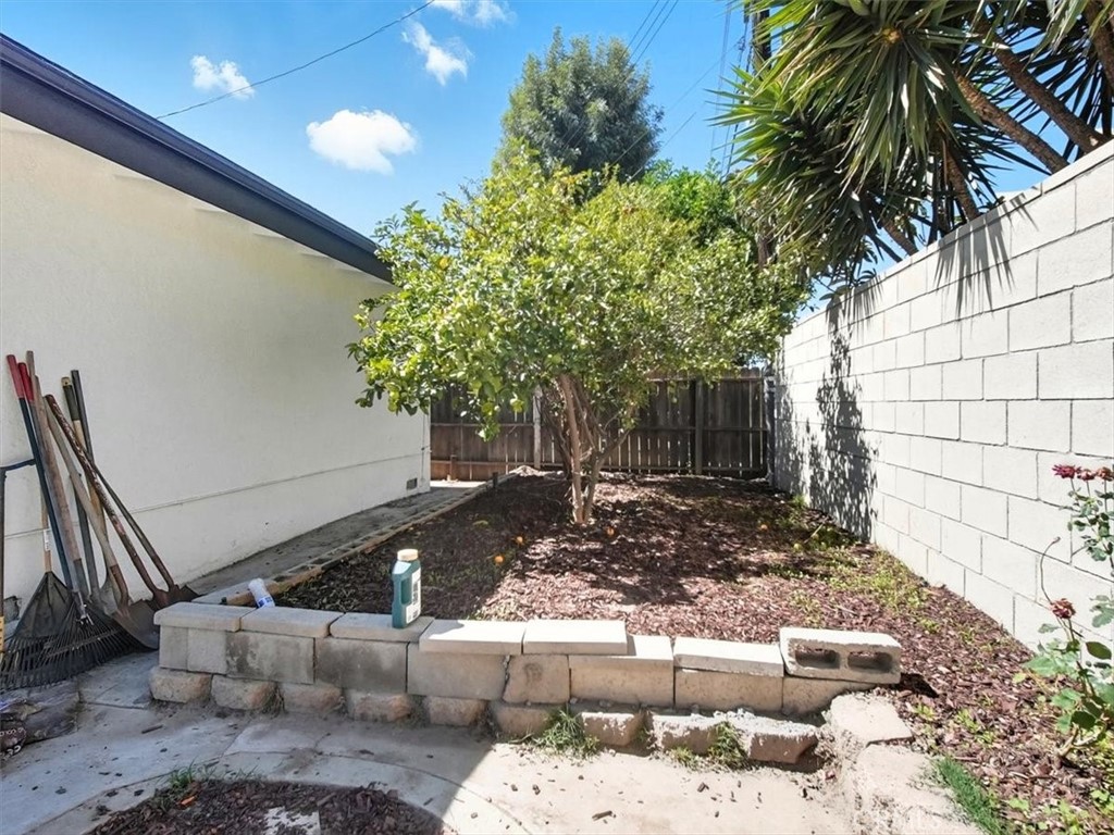 1407 Colonial Avenue Anaheim, CA 92802 - Photo 27 of 33 a view of a yard with plants and a fountain