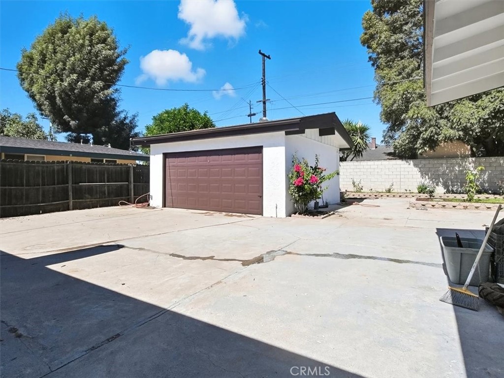 1407 Colonial Avenue Anaheim, CA 92802 - Photo 29 of 33 a view of a white house with a yard and garage