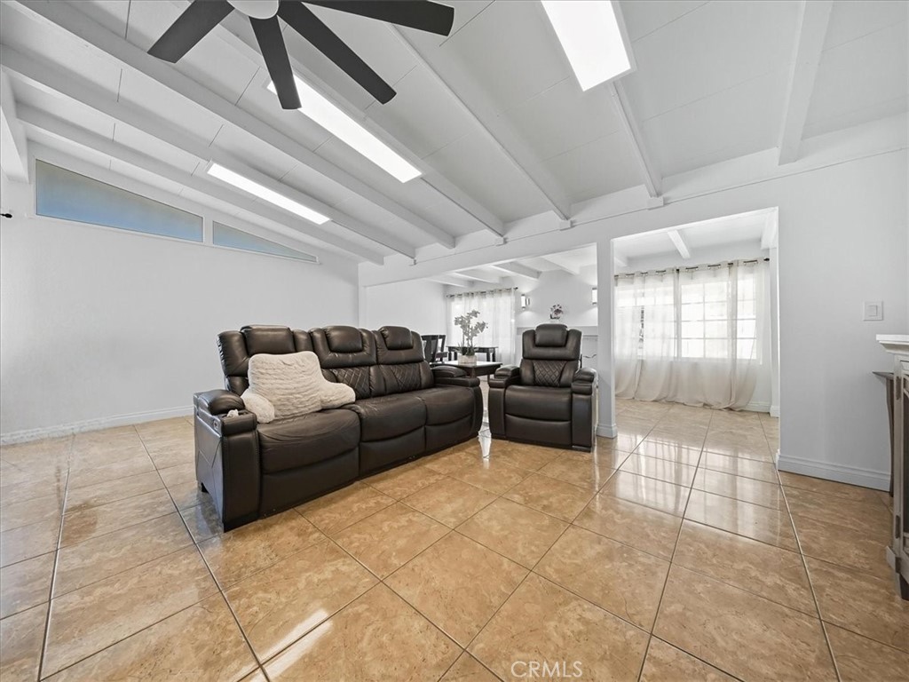 1407 Colonial Avenue Anaheim, CA 92802 - Photo 4 of 33 a living room with furniture and a glass door