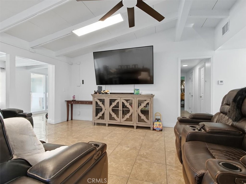 1407 Colonial Avenue Anaheim, CA 92802 - Photo 5 of 33 a living room with furniture and a flat screen tv