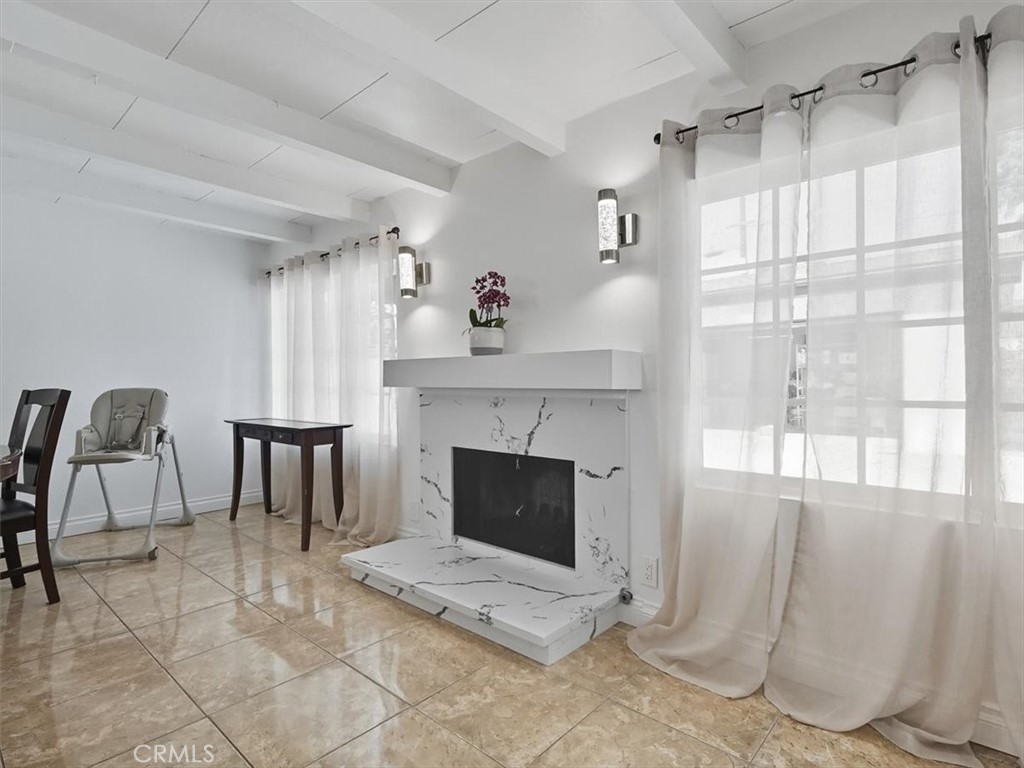 1407 Colonial Avenue Anaheim, CA 92802 - Photo 7 of 33 a living room with furniture and a fireplace