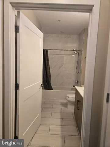 a bathroom with a glass door shower