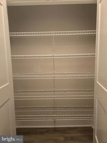 a view of a room with racks on the wall