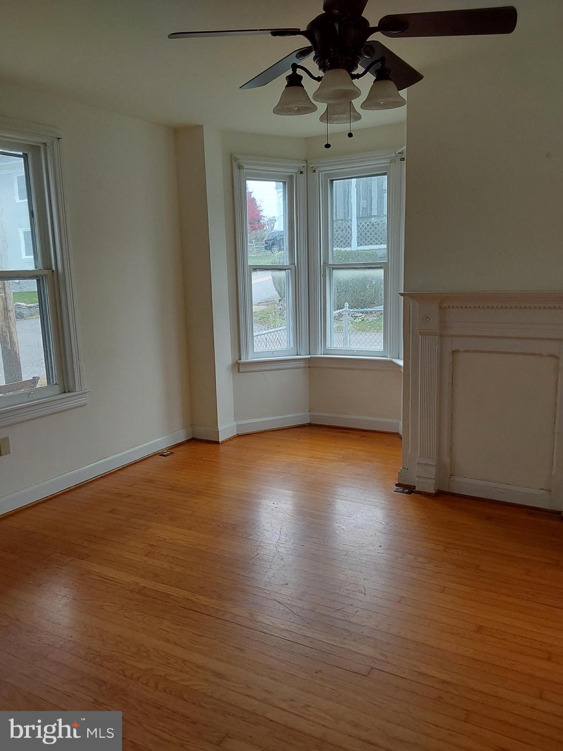 4300 Main Street Rohrersville, MD 21779 - Photo 3 of 19 a view of empty room with wooden floor and fan