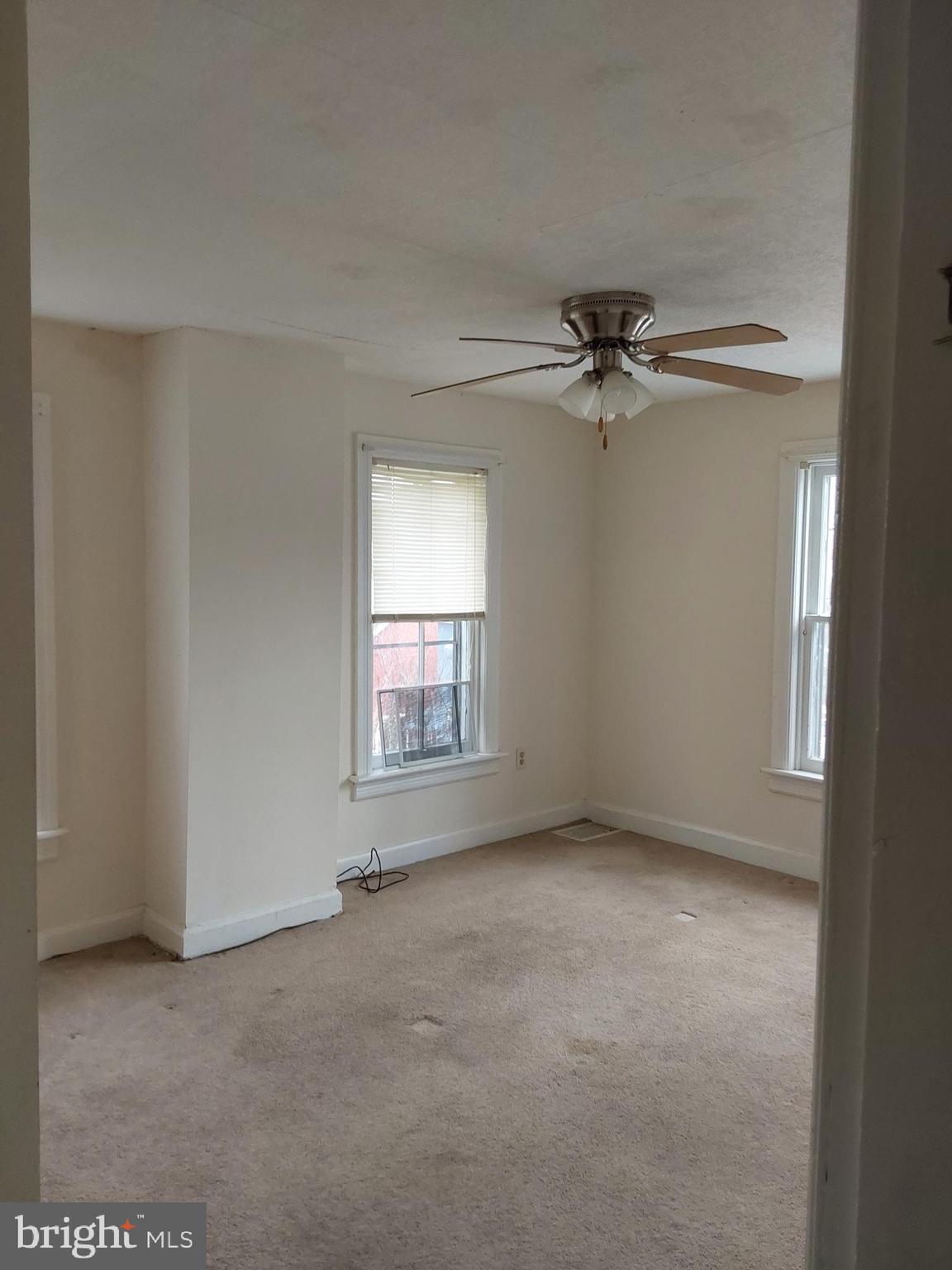 4300 Main Street Rohrersville, MD 21779 - Photo 10 of 19 an empty room with a ceiling fan and windows