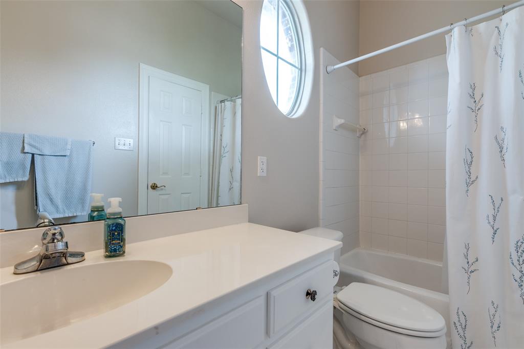 12198 Bell Road Pilot Point, TX 76258 - Photo 21 of 40 Secondary full bathroom with shower / tub combo with curtain, vanity, and toilet