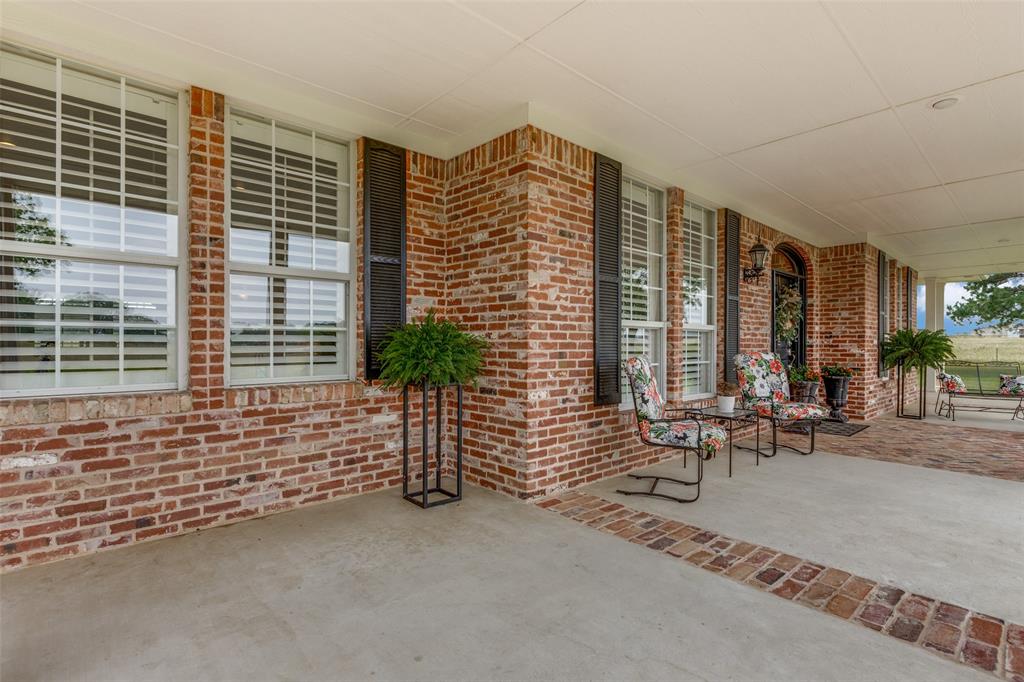 12198 Bell Road Pilot Point, TX 76258 - Photo 26 of 40 Enjoy relaxing on the beautiful front porch.