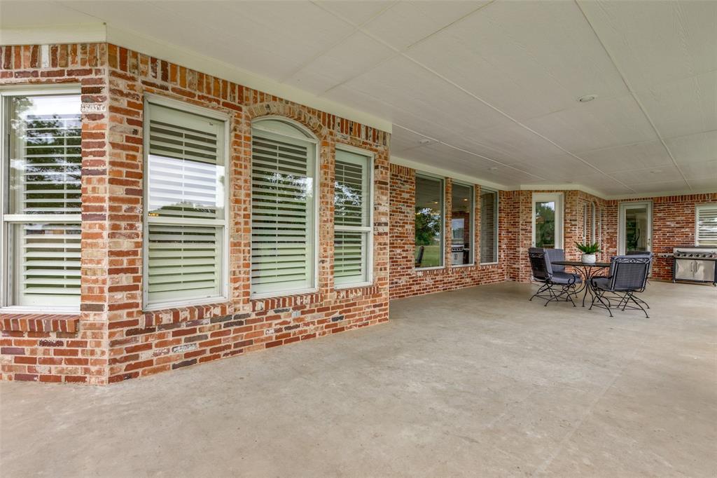 12198 Bell Road Pilot Point, TX 76258 - Photo 28 of 40 Enjoy the gorgeous sunsets & pond views from the expansive back patio.