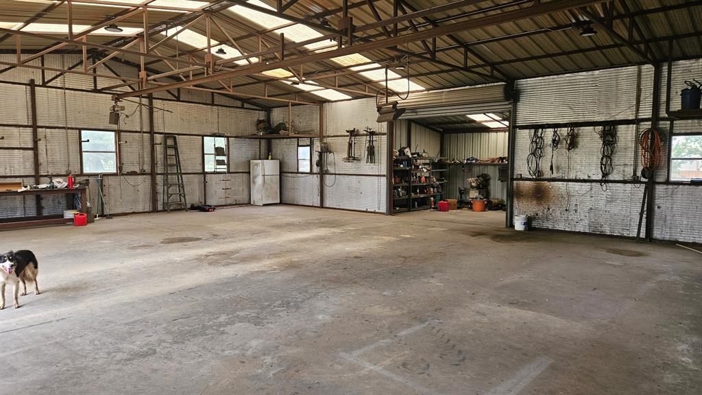 12198 Bell Road Pilot Point, TX 76258 - Photo 32 of 40 Enclosed 2,285 sqft shop/barn is equipped with concrete floor, electricity, and water.