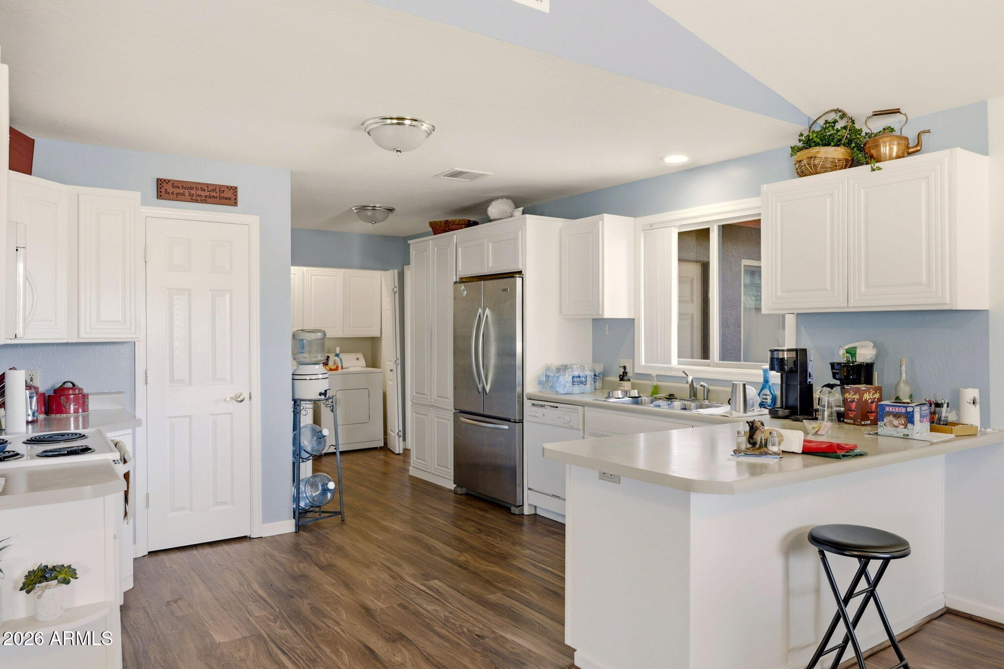 2746 Pineview Court Overgaard, AZ 85933 - Photo 12 of 30 a kitchen with a refrigerator and a stove top oven