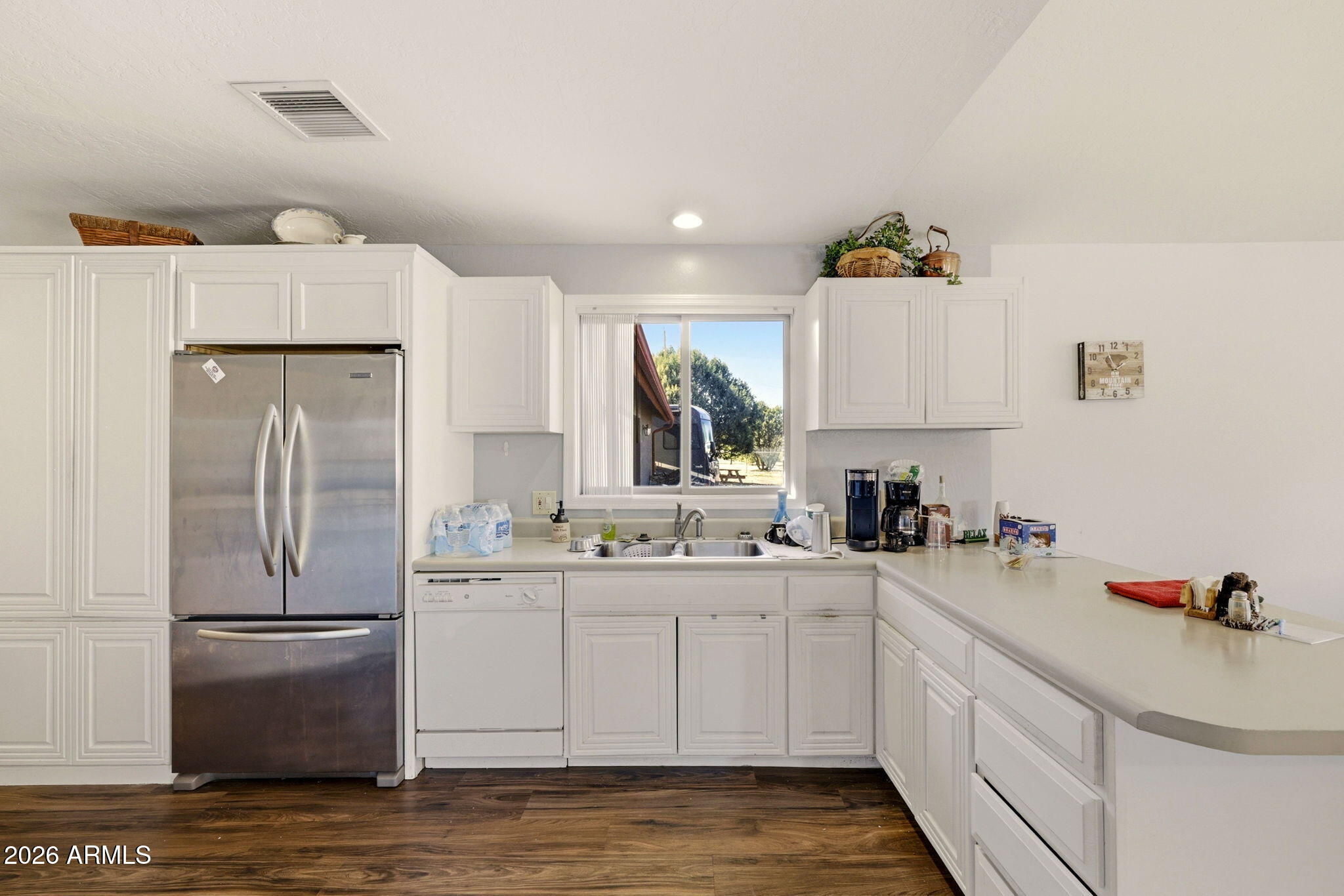 2746 Pineview Court Overgaard, AZ 85933 - Photo 14 of 30 a kitchen with a sink cabinets and refrigerator